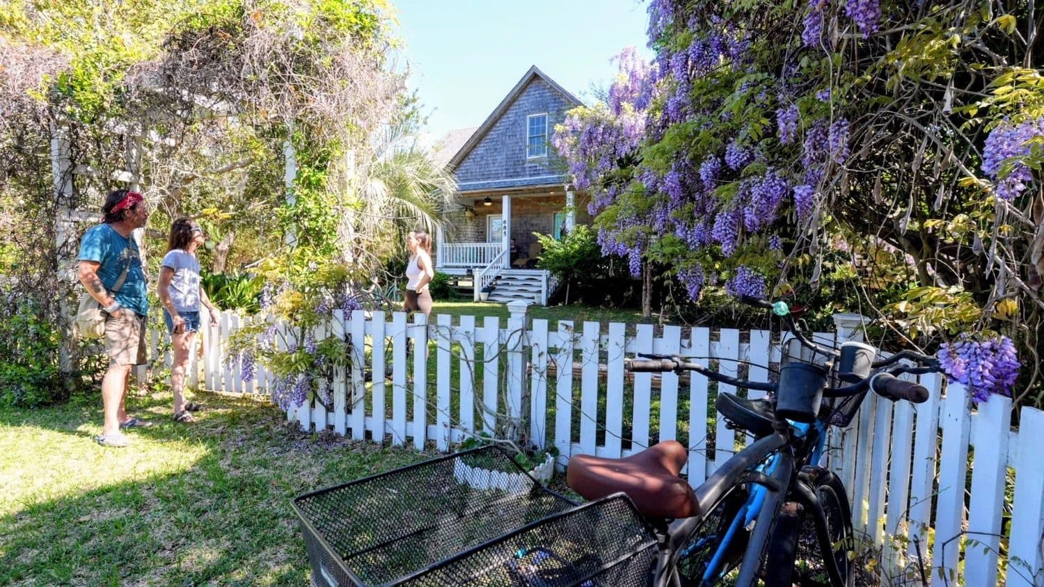 Guests arriving by bike at the Thurston House garden gate